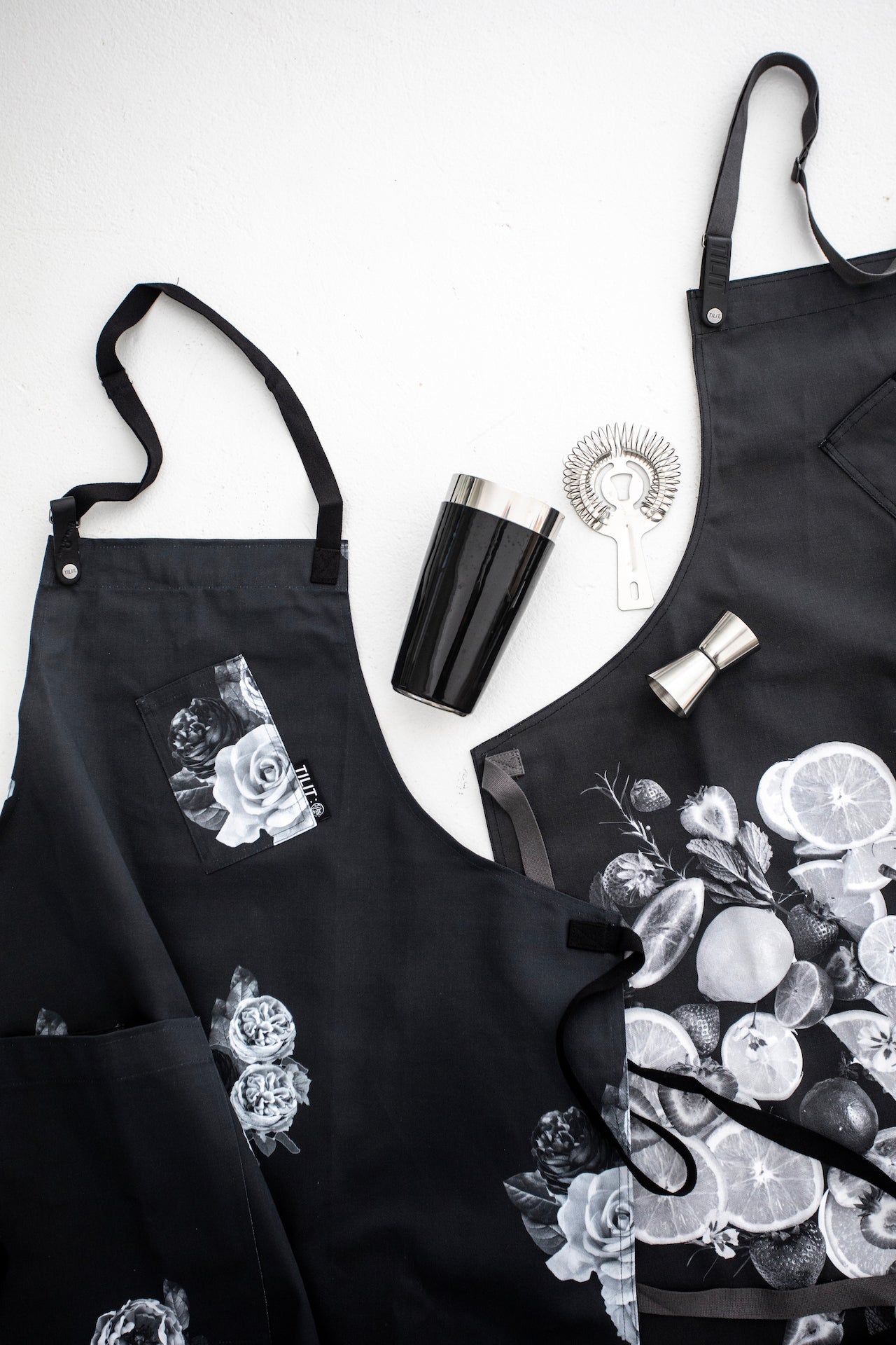 death and co flower and citrus aprons
