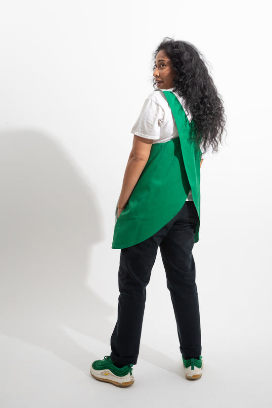 back of green smock apron