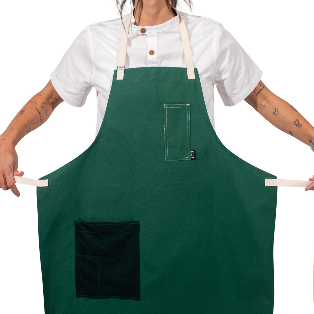 TILIT Green Apron with white straps a chest pocket and a mesh hip pocket