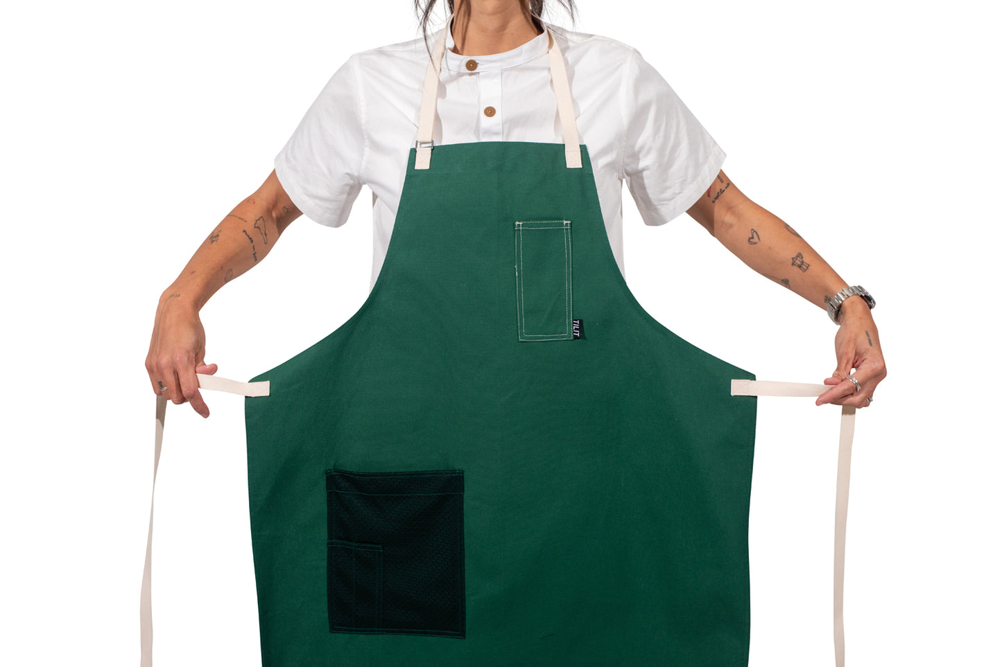 TILIT Green Apron with white straps a chest pocket and a mesh hip pocket