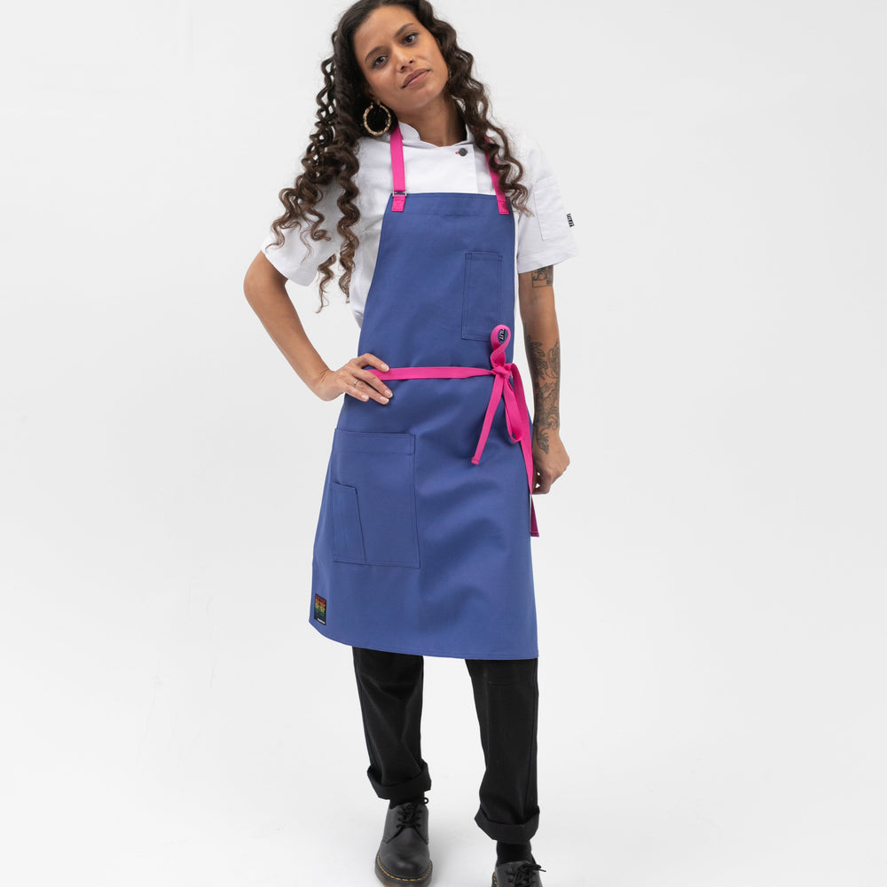 bib style apron in blue with pink straps