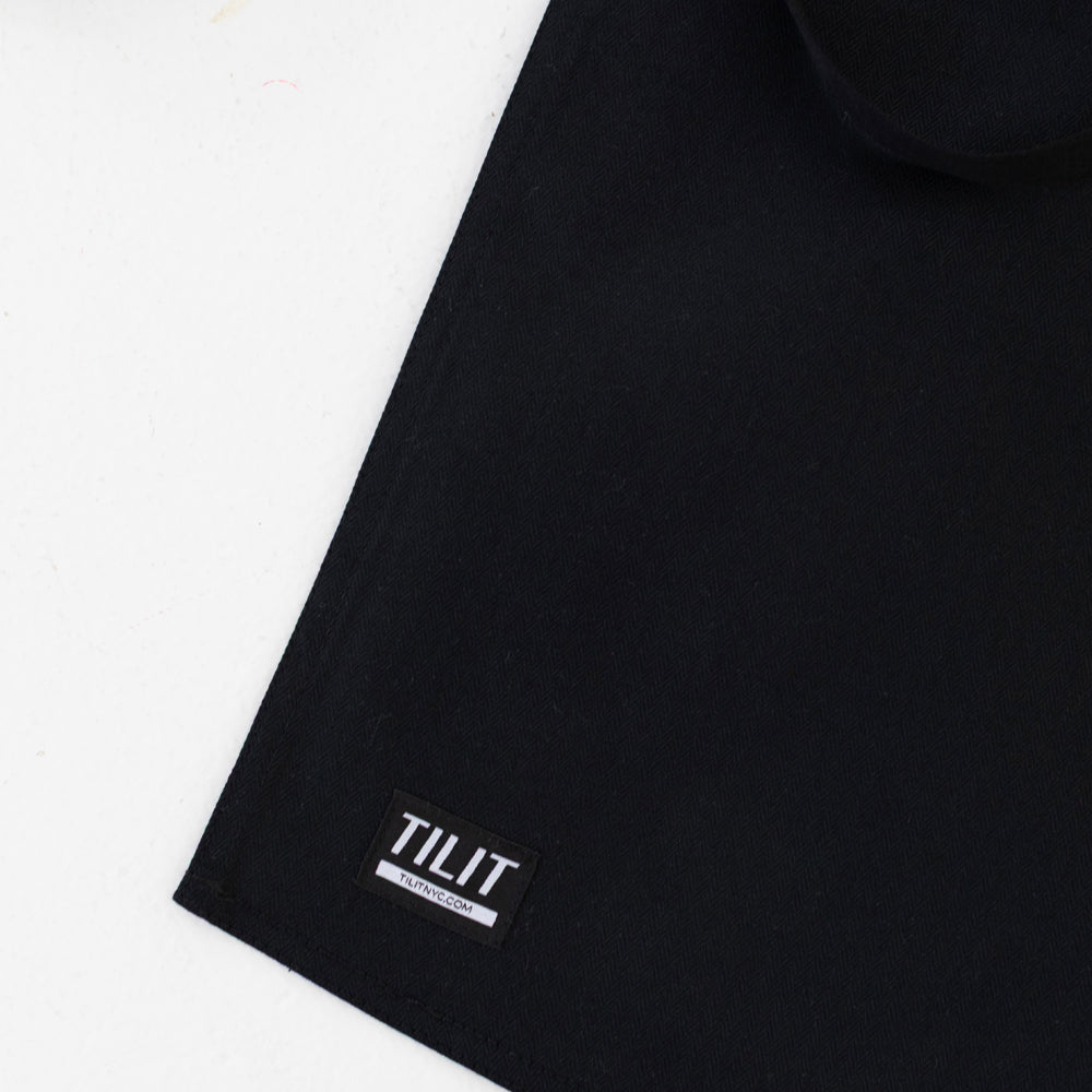 
                  
                    Black wax cotton apron 
                  
                