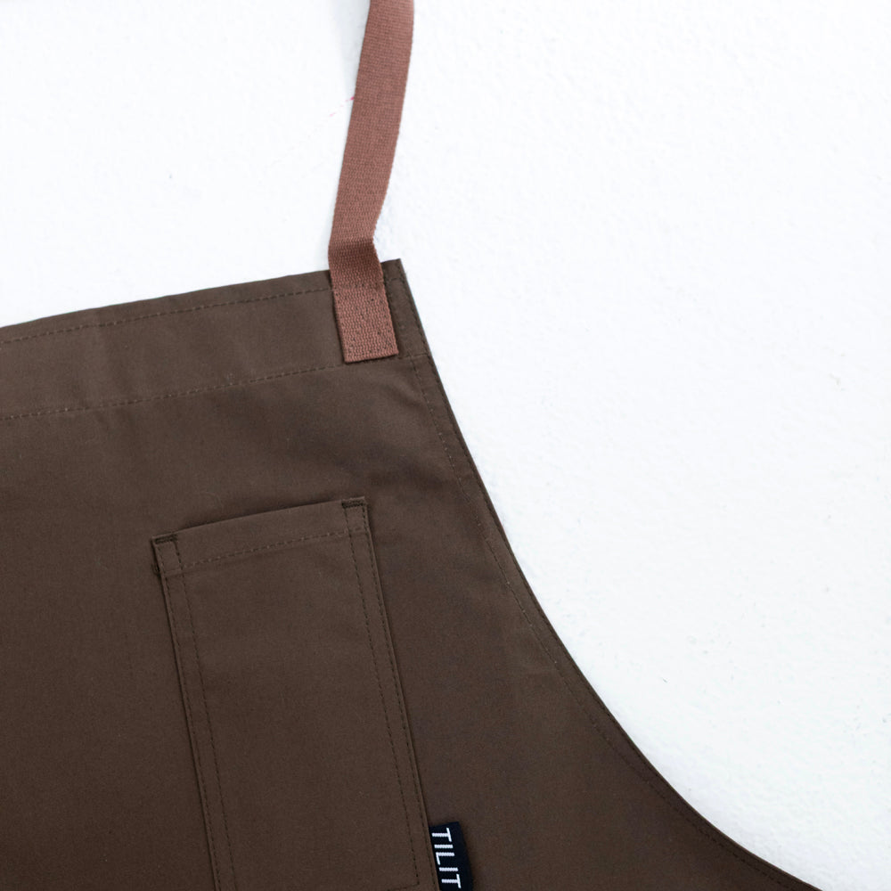 
                  
                    Olive wax cotton apron 
                  
                