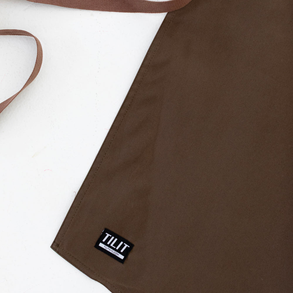 
                  
                    Olive wax cotton apron 
                  
                