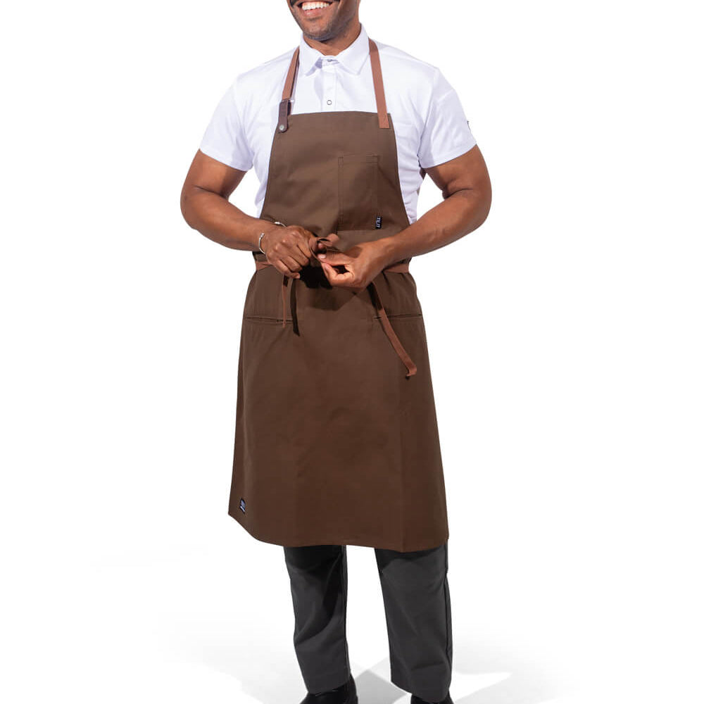 Man wearing a olive apron on a white background