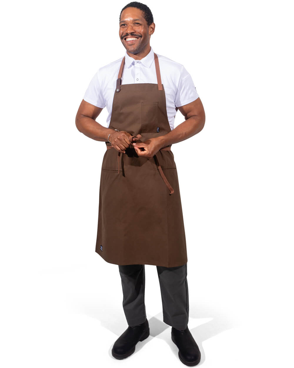 Man wearing a olive apron on a white background