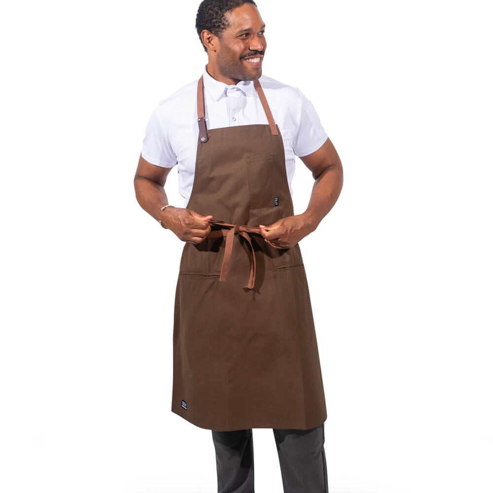 
                  
                    Man wearing a olive apron on a white background
                  
                