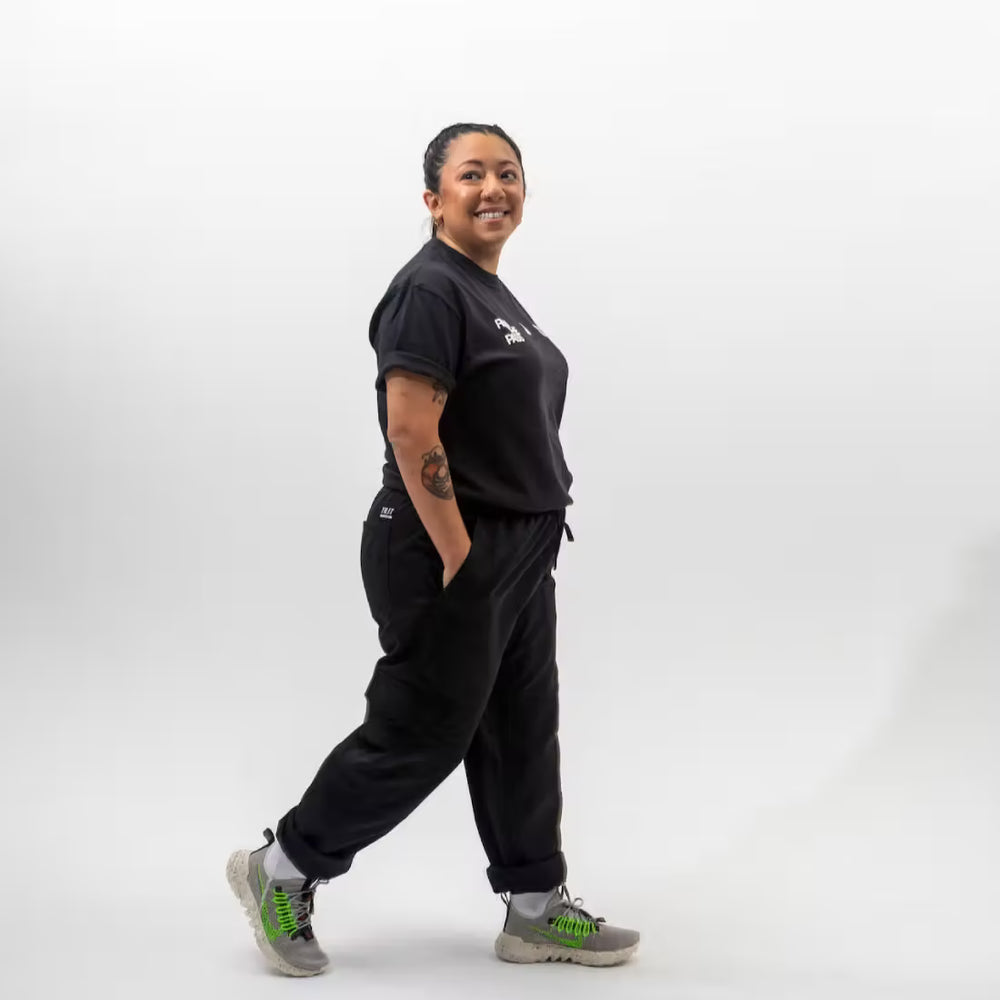 
                  
                    “Run the Pass” Short Sleeve T-shirt with Iconic Graphic
                  
                