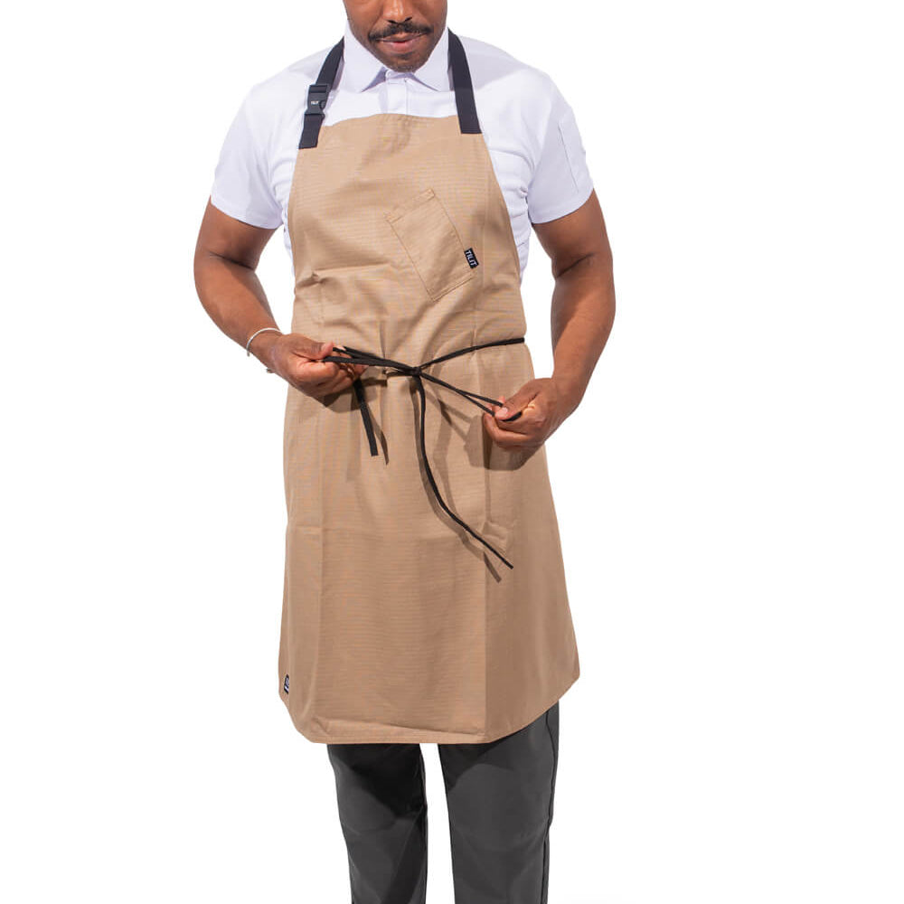 
                  
                    Man wearing a beige apron on a white background
                  
                