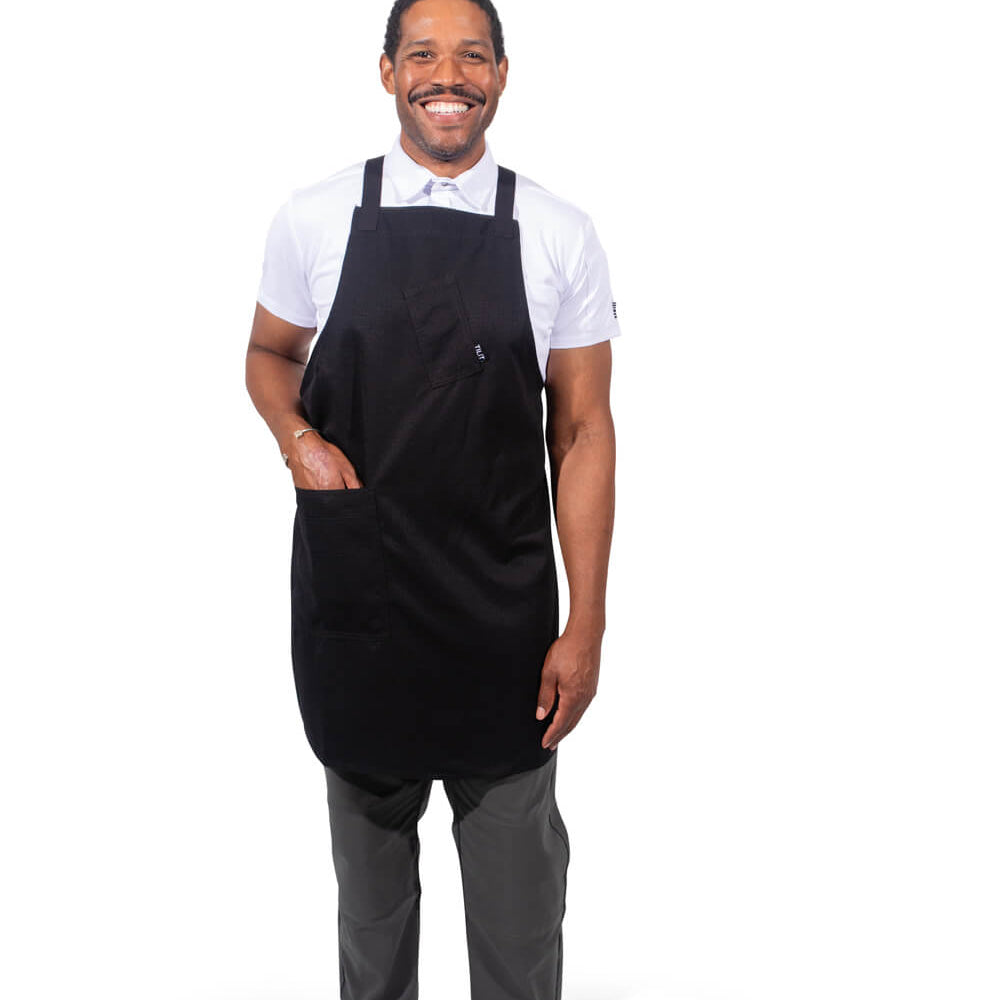 Male model wearing a black cross back apron 