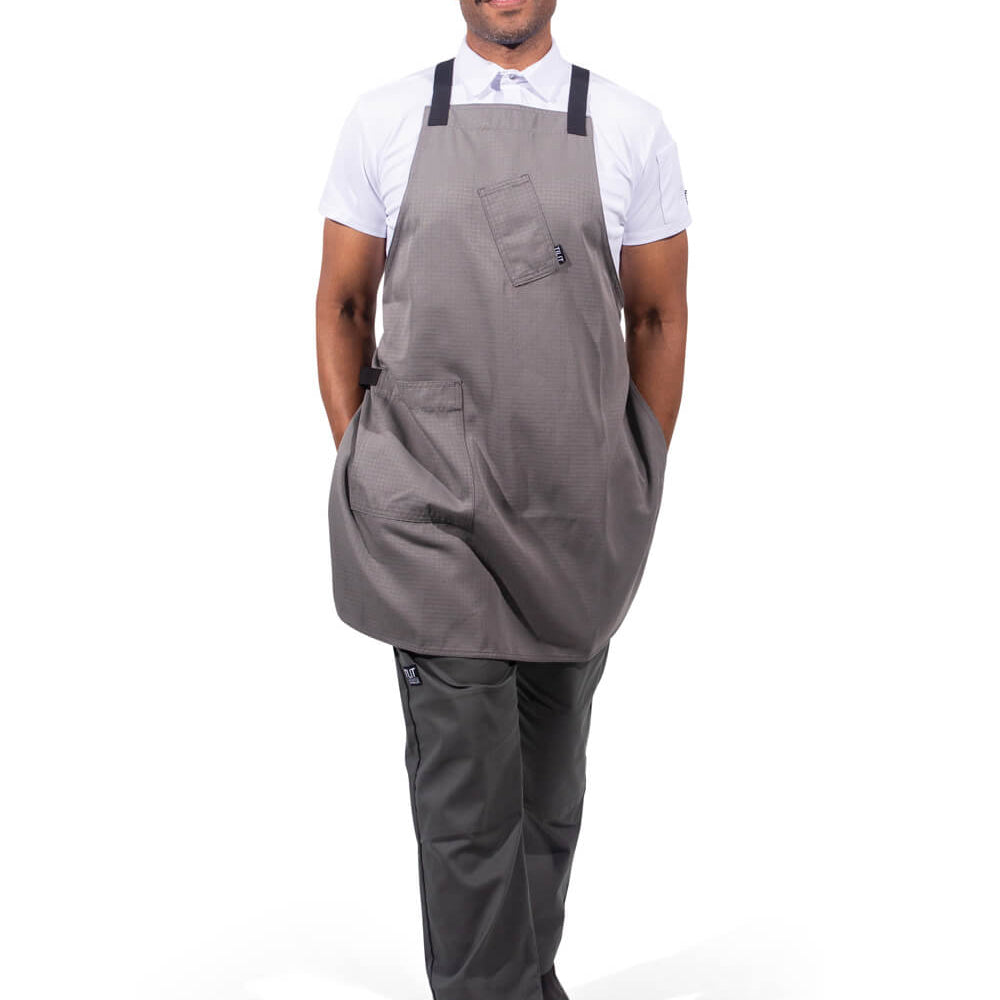 Male model wearing a gray cross back apron 