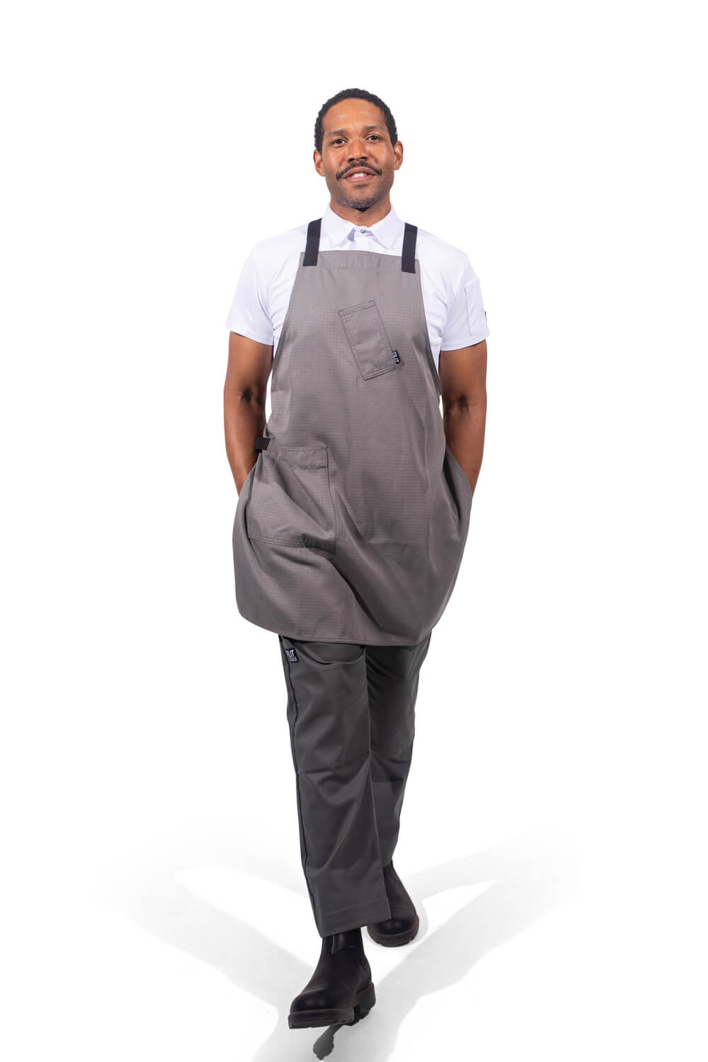 Male model wearing a gray cross back apron 