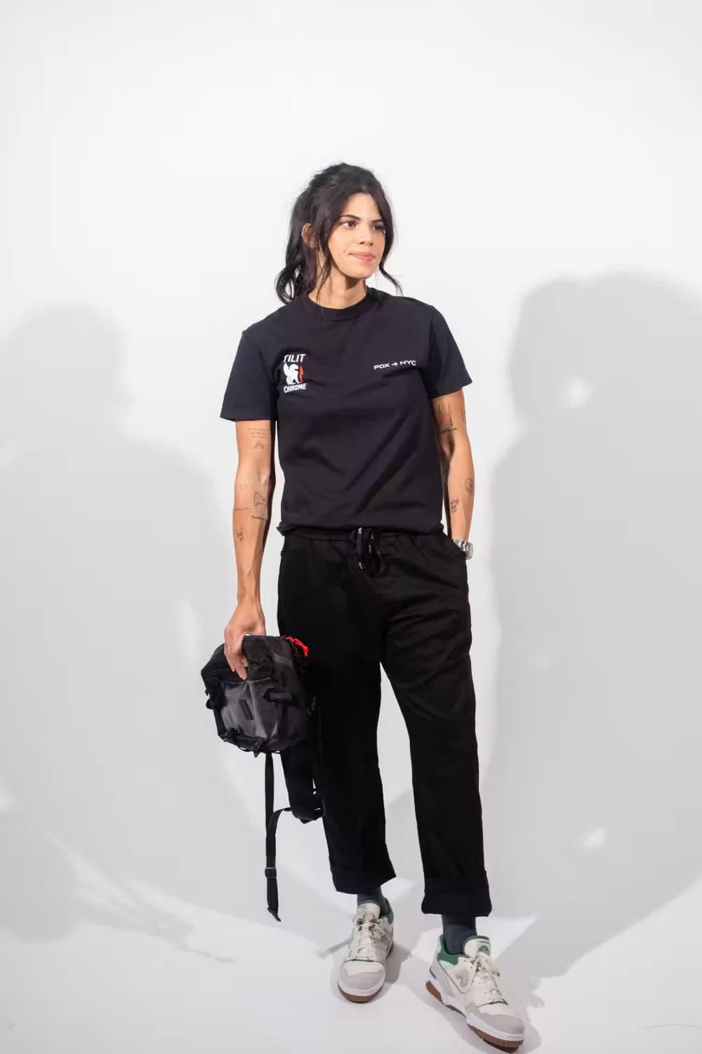 sling Knife bag in black with gray mesh with a red zipper