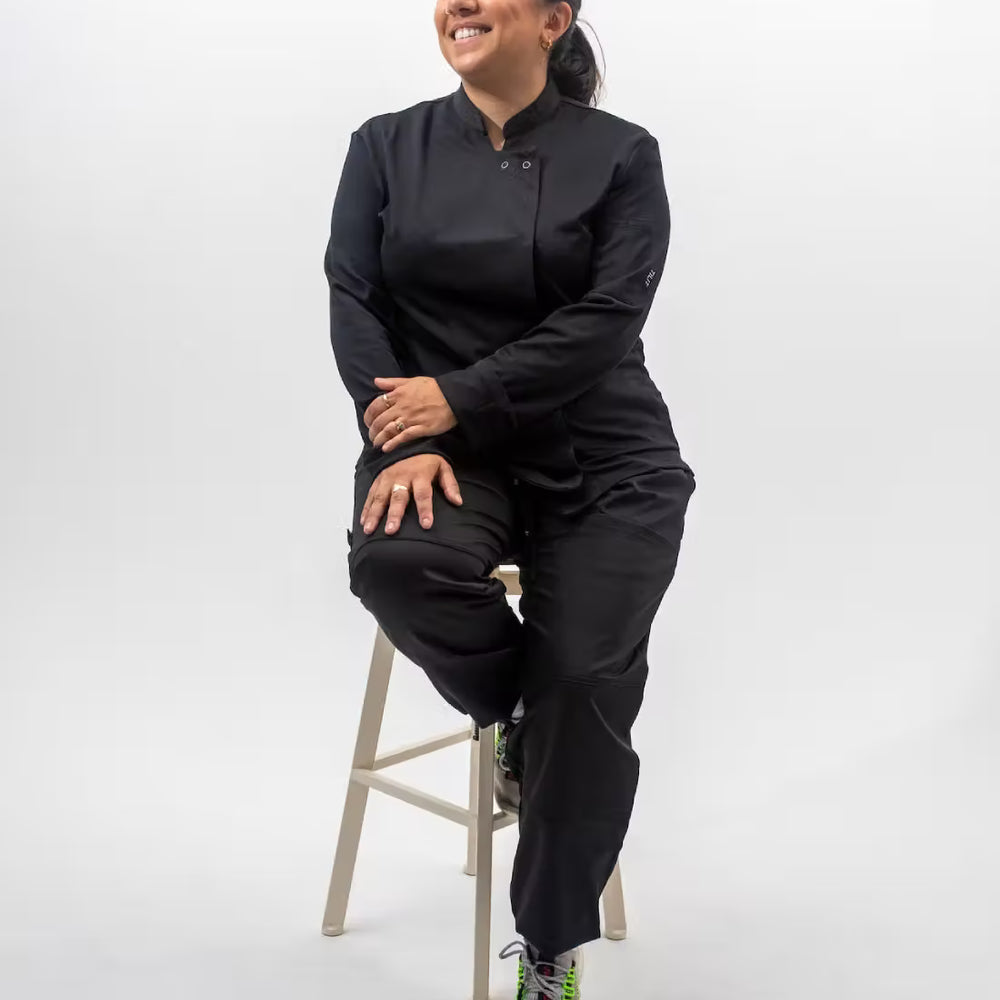 Model is wearing the Long Sleeve Black Supply Chef coat in black