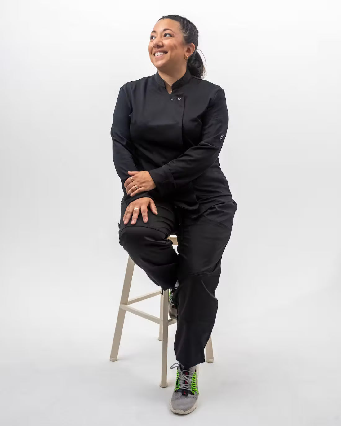 Model is wearing the Long Sleeve Black Supply Chef coat in black